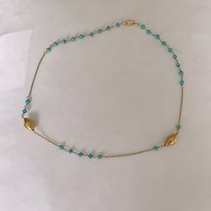 A turquoise and  14 carat gold necklace